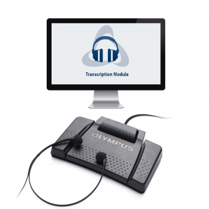 Olympus transcription kit with foot pedal and headset displayed in front of a computer monitor that shows a transcription module.