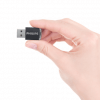 Photo of hand holding the Philips AirBridge - demonstrating size of AirBridge being less than half a finger long