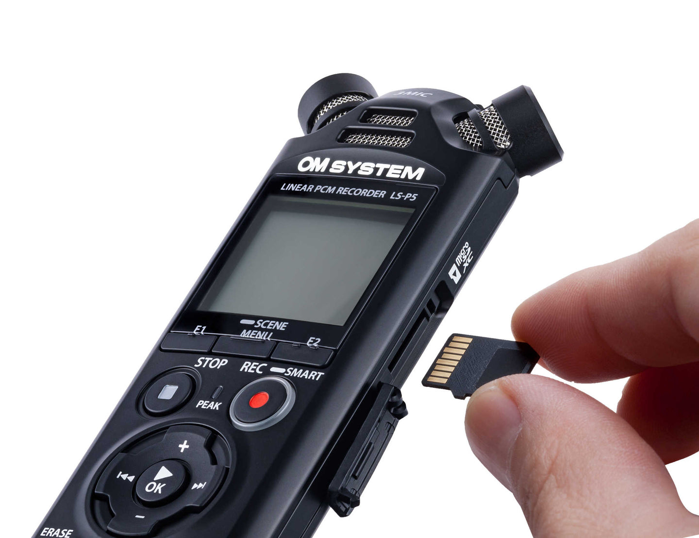 OM System digital voice recorder with a hand inserting an SD card on a white background