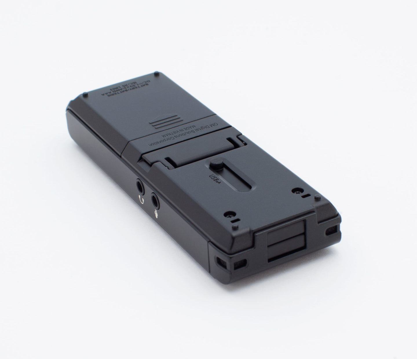 Back view of WS-883, sitting flat on a surface, showing battery cover and audio jacks on the side for microphone and headset