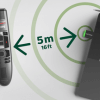 SpeechOne Remote controls sitting on diagram of concentric circles showing 5m range of wireless connection
