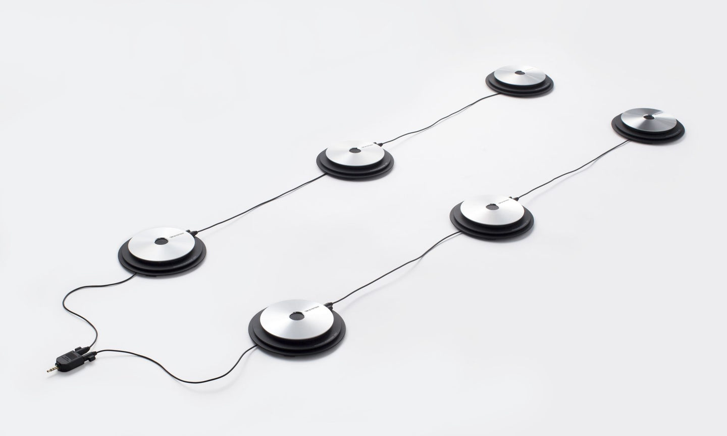 Six OM System ME33  boundary microphones set up in two lines of three to connect to voice recorder with audio splitter plug