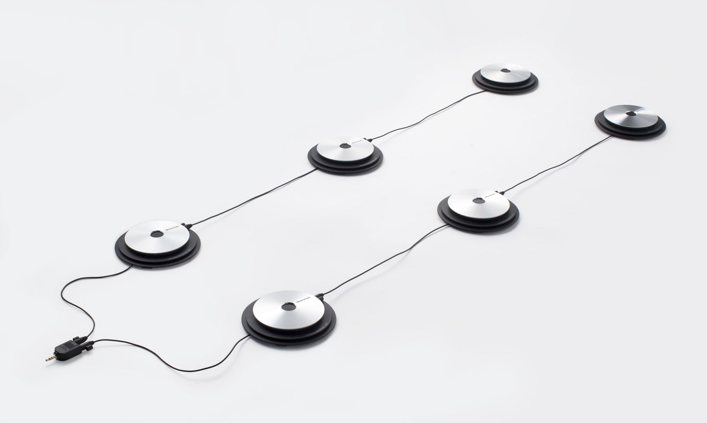 Six OM System ME33  boundary microphones set up in two lines of three to connect to voice recorder with audio splitter plug